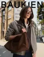 A selection of sustainable clothing items from the Baukjen Catalog including organic cotton tops and recycled wool sweaters.