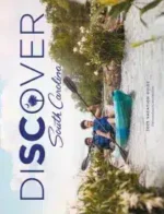 South Carolina Travel Guide: A scenic view of the Charleston battery at sunset with historic houses and palm trees.